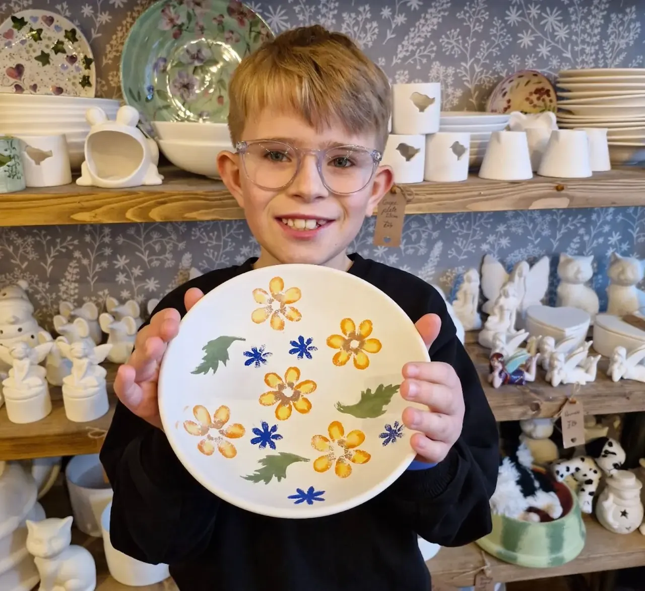 Close-up of pottery painting process