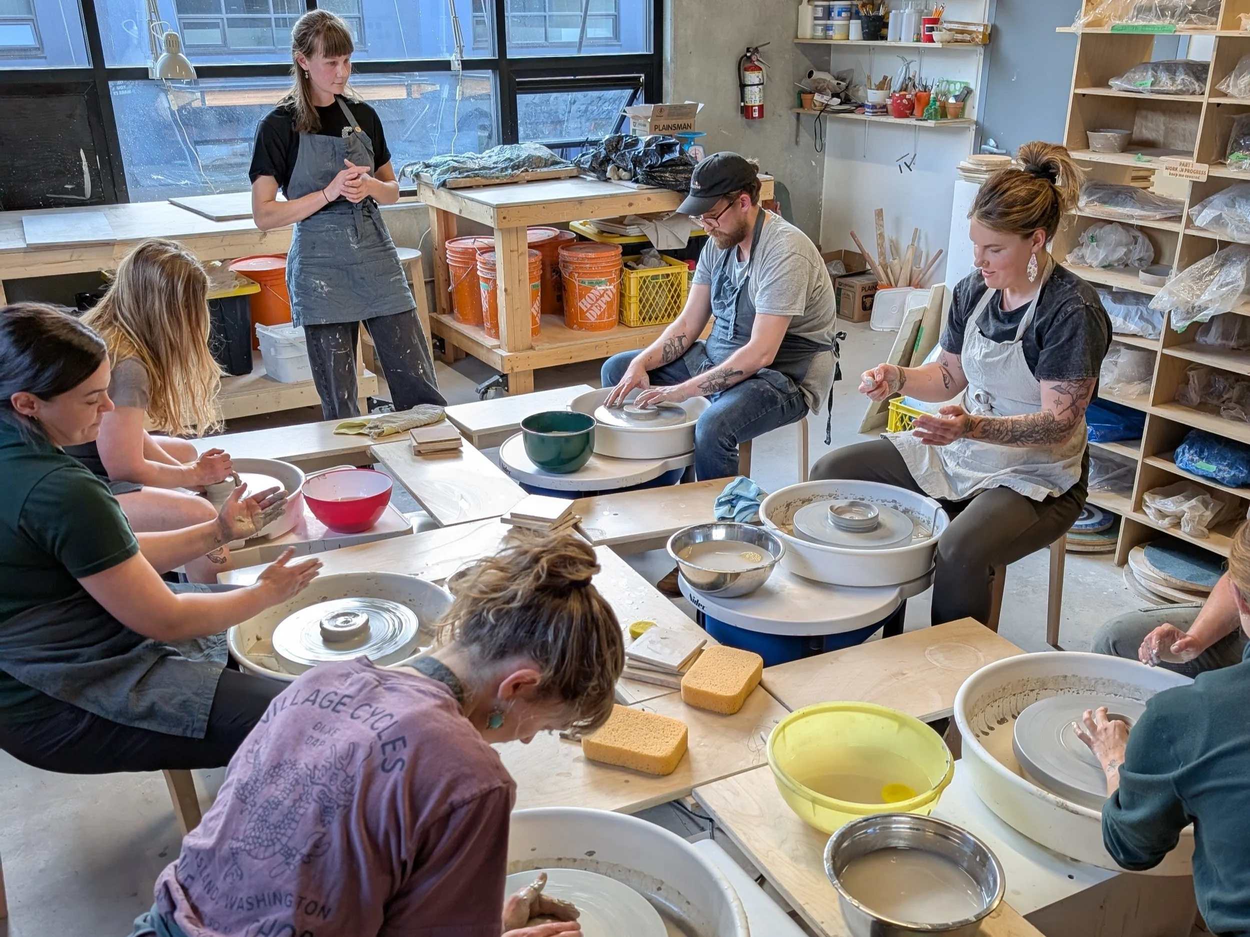 Guided pottery class session in progress
